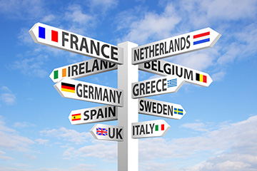 A sign that shows different countries names and flags